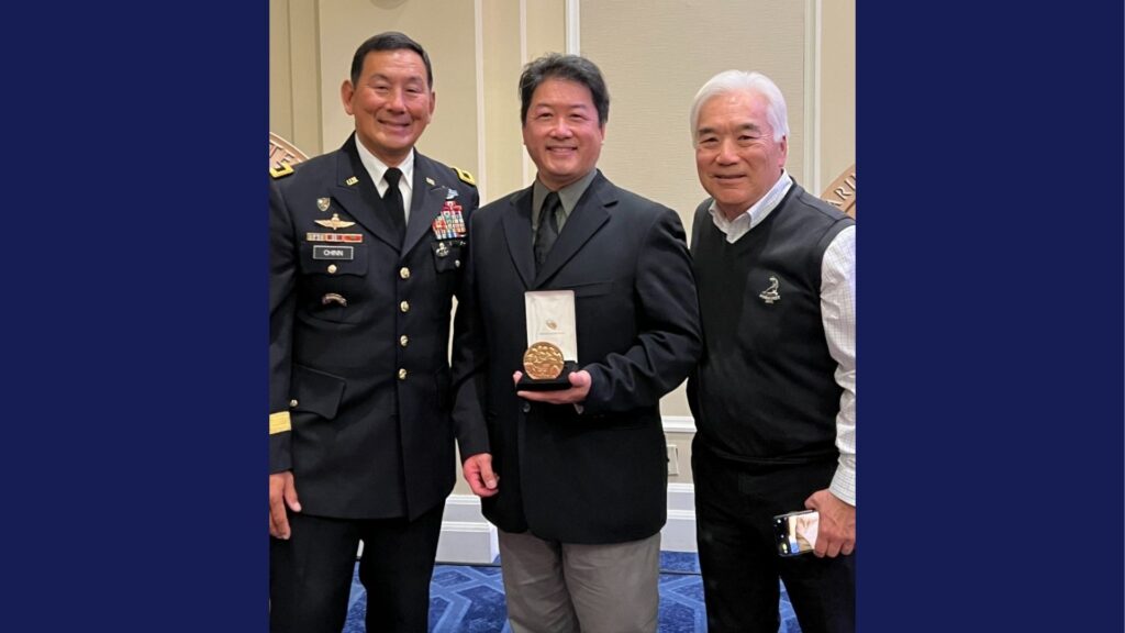 Jeffrey Young and Winston Young pose for a photo with Major General K.K. Chinn after receiving a Congressional Gold Medal for Jeffrey's father (Winston's uncle)