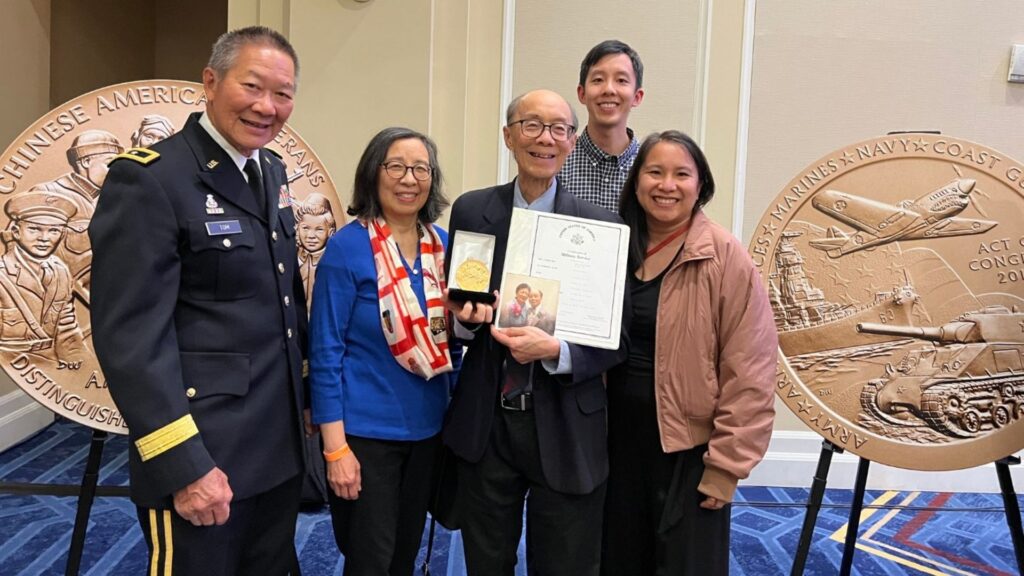 Halbert Chin family posing for a photo with Major General Stephen Tom after receiving a Congressional Gold Medal on behalf of their father