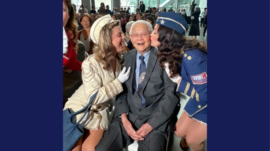 Living Chinese American WWII veteran being kissed