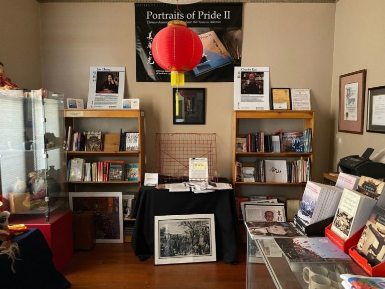 Photos of the CHSSC Bookstore with another display case, two small bookshelves, information posters and a red Chinese lamp