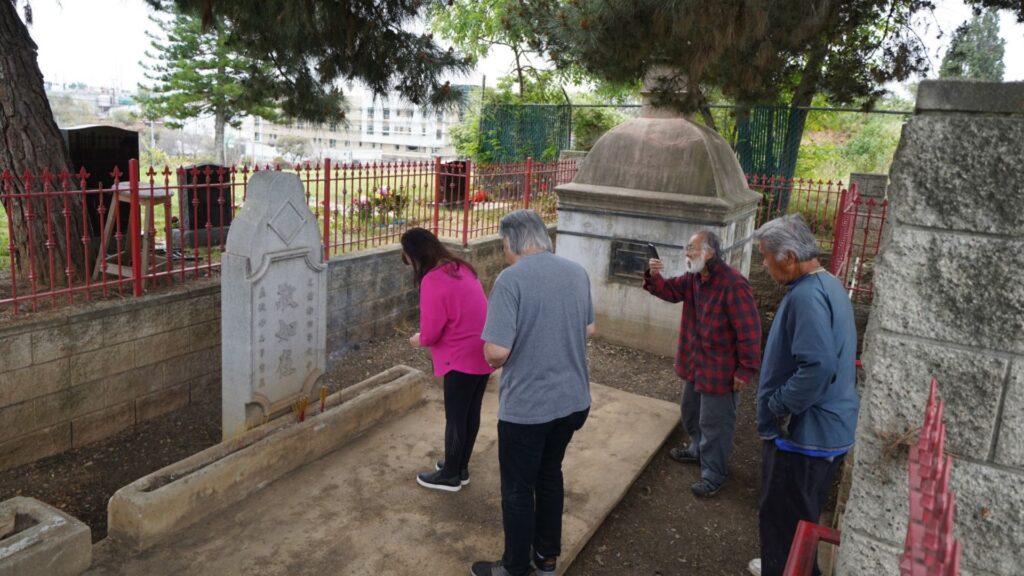 Praying to ancestors at Chinese Shrine in Evergreen Cemetery