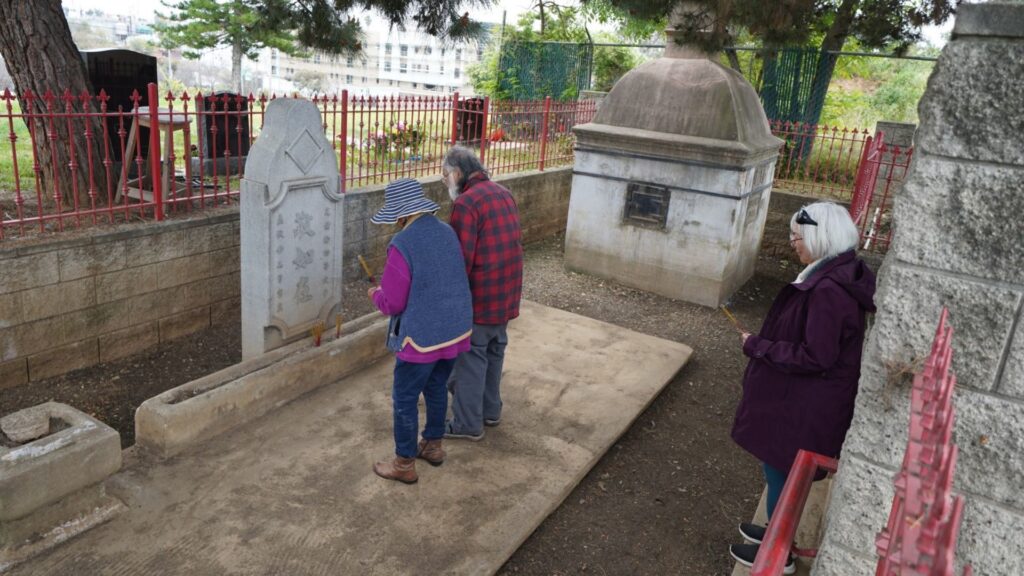 Praying to ancestors at Chinese Shrine in Evergreen Cemetery