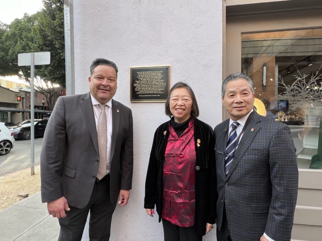 Pasadena Mayor Gordo, Susie Ling and Councilmember Gene Masuda standing next to the new plaque in Mills Alley.