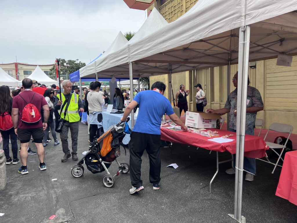 Visitors to the CHSSC booth at the Firecracker Run