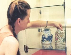 Woman arranging MTA Artifacts in a display case
