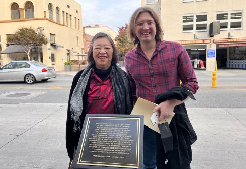 Susie Ling and Matt Hormann standing behind new plaque on Fair Oaks Ave