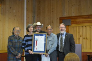 Photo of Eugene Moy, Susan Dickson, and Jack Shu receiving a proclamation
